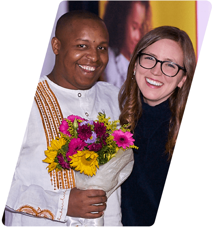 mwangi smiling with flowers